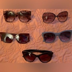 5 pair of GUC sunglasses